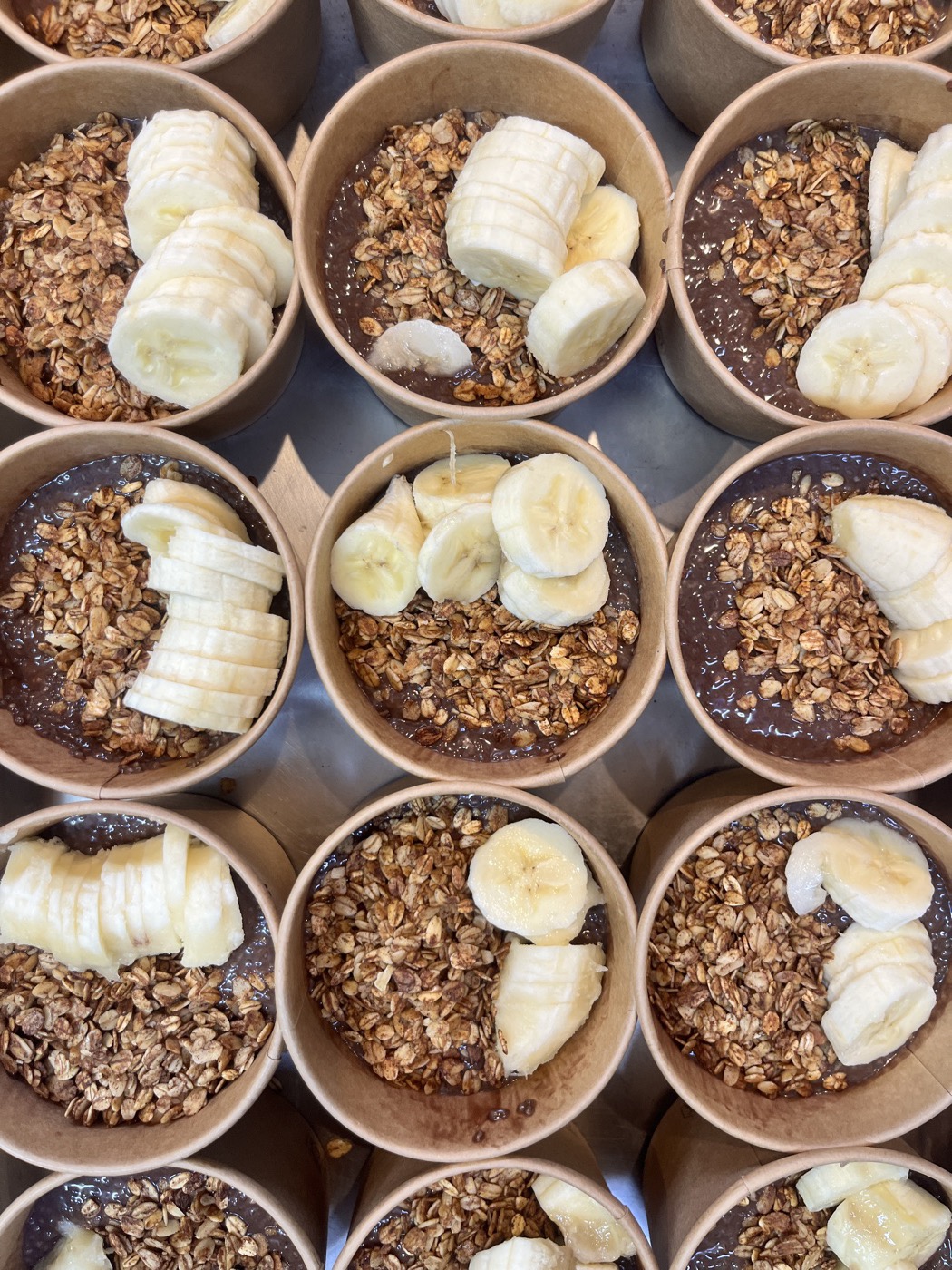 Chocolate chia pudding with granola and banana for a healthy catering breakfast